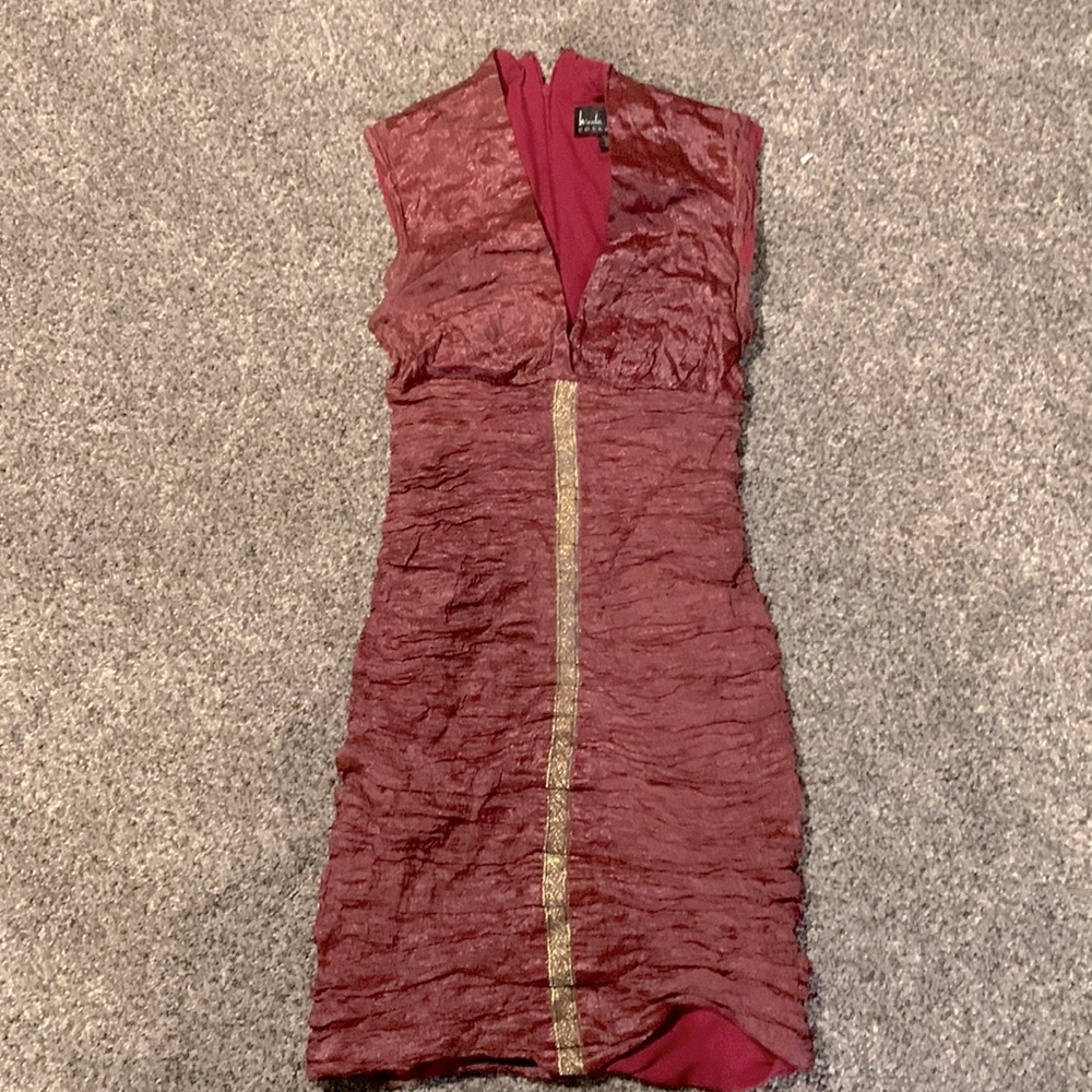 Nicole Miller, maroon with a shimmer, textured with gold accent in the front.